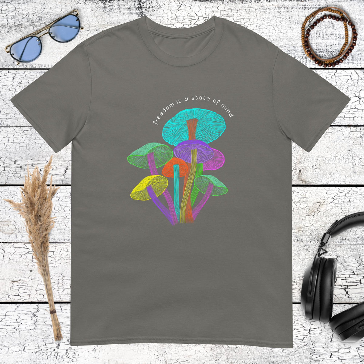 Dark charcoal t-shirt with a colorful magic mushroom art print and spiritual quote