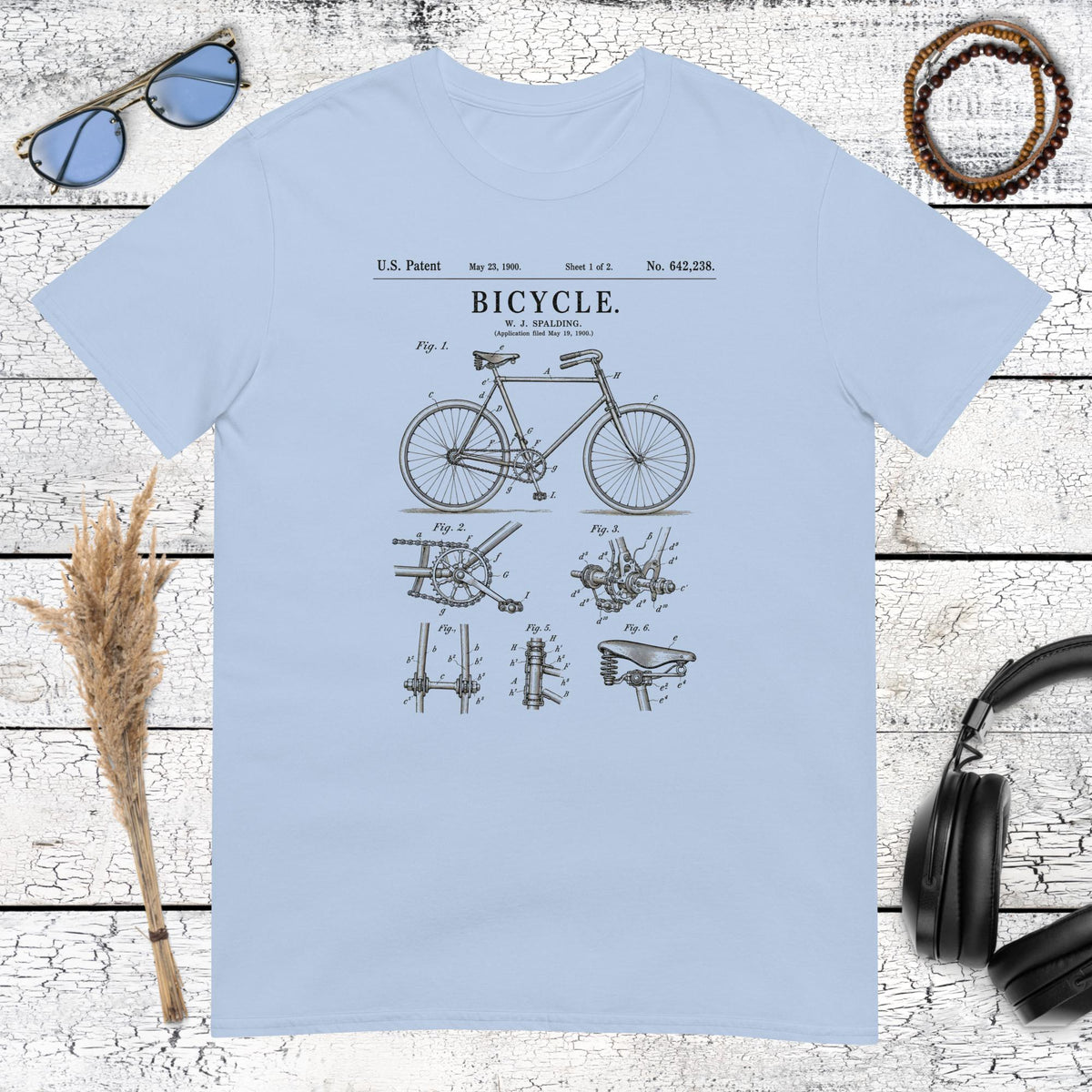 Vintage bicycle graphic with nostalgic lettering printed on a light blue t-shirt