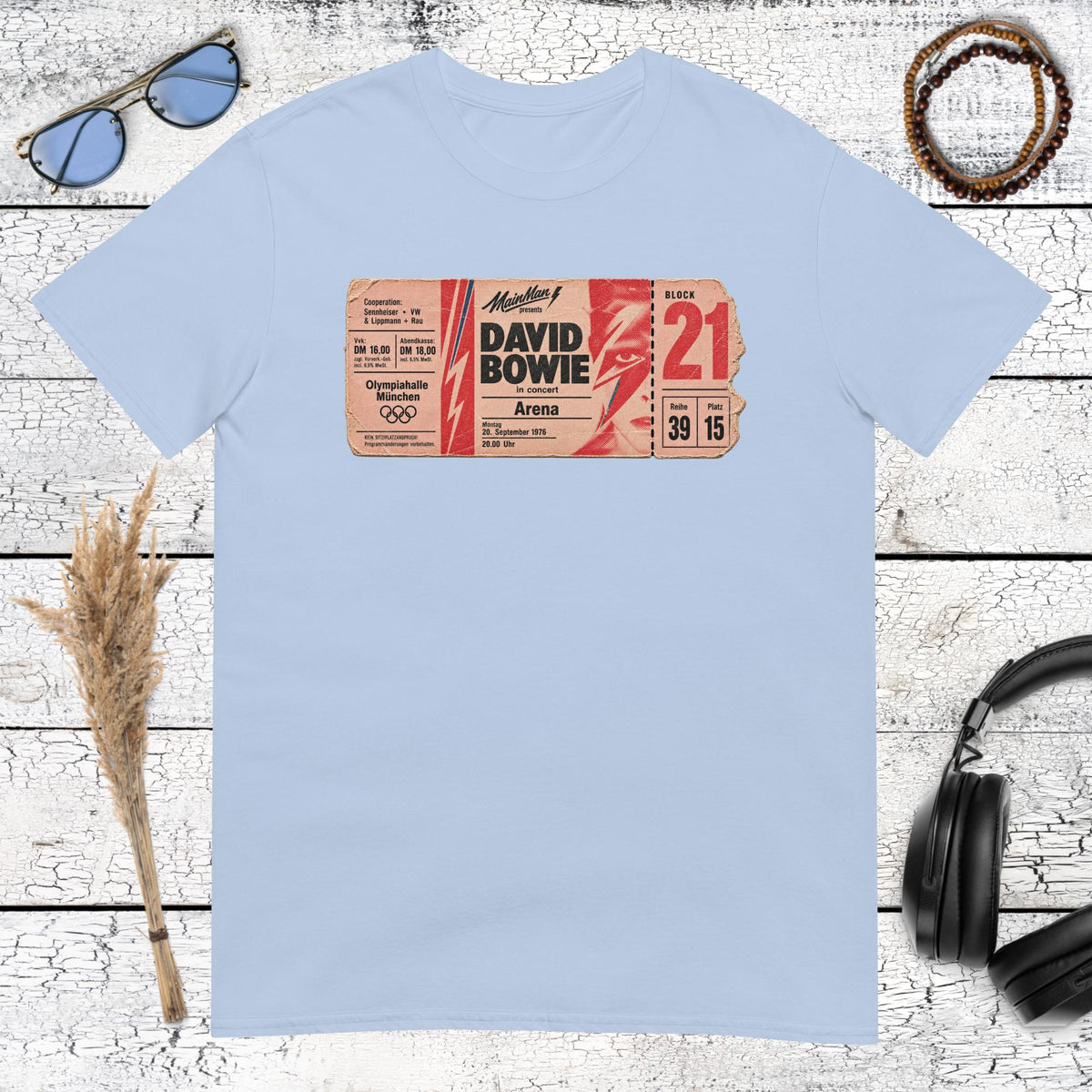 Vintage music graphic with bold typography printed on a light blue t-shirt