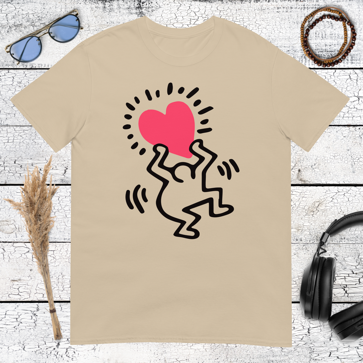 Sand colored t-shirt featuring a Keith Haring inspired pop art heart