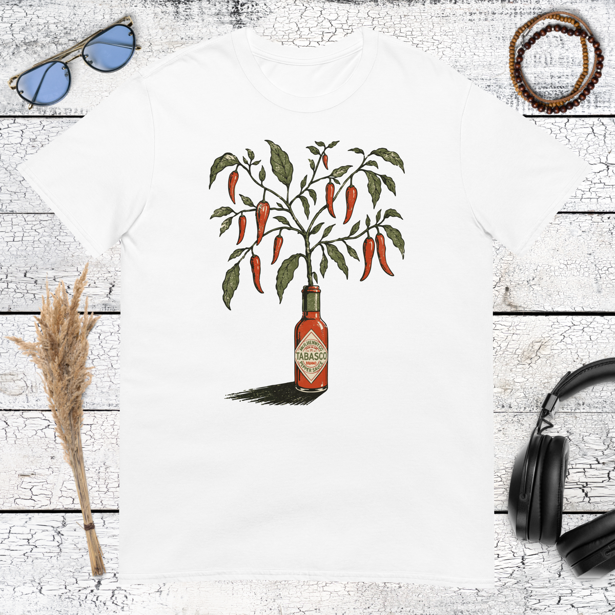 Red chili plant sprouting from a hot sauce bottle illustration on a white t-shirt