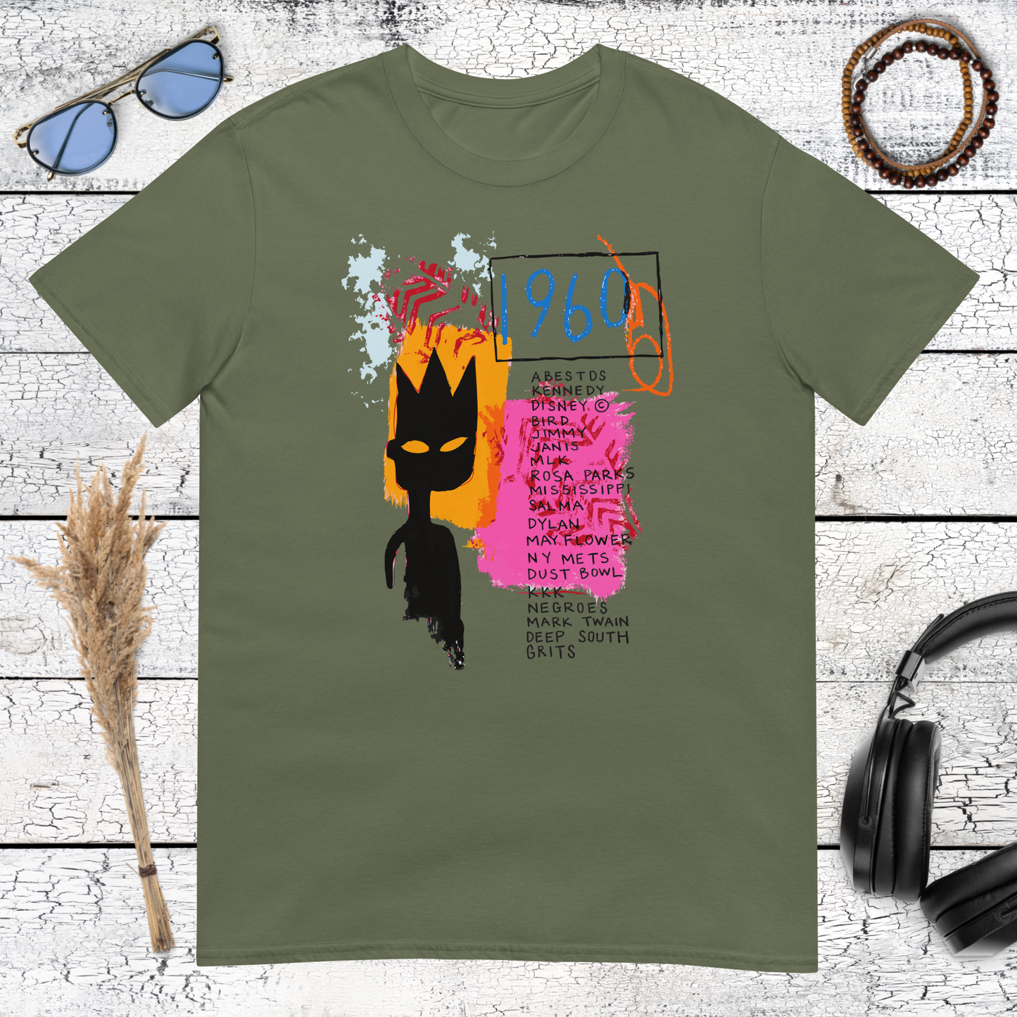 Bold crowned portrait with abstract graffiti details on a military green t-shirt