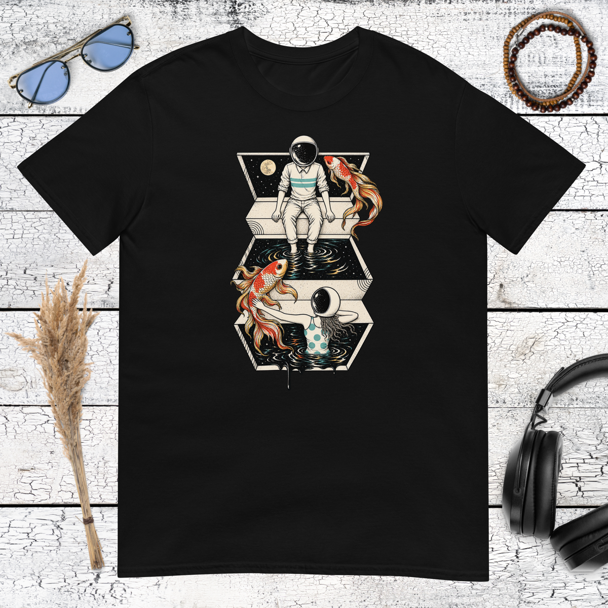 Surreal astronaut and koi fish space collage graphic printed on a black t-shirt