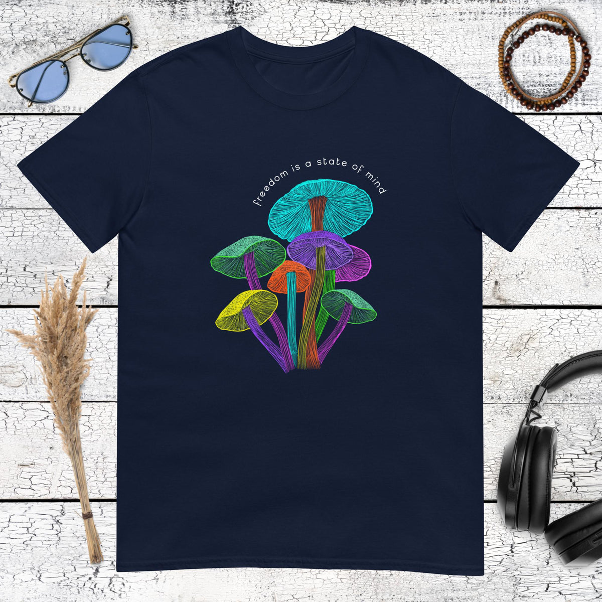 Surrealist mushroom illustration featuring purple and green glowing fungi on a navy blue t-shirt