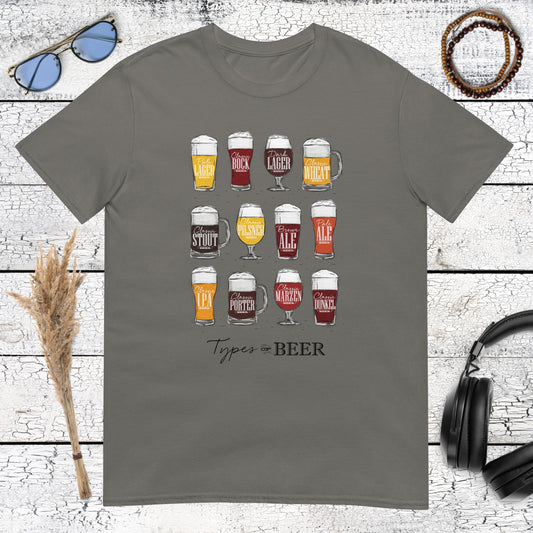Detailed illustration of various beer types in different glasses on a charcoal t-shirt