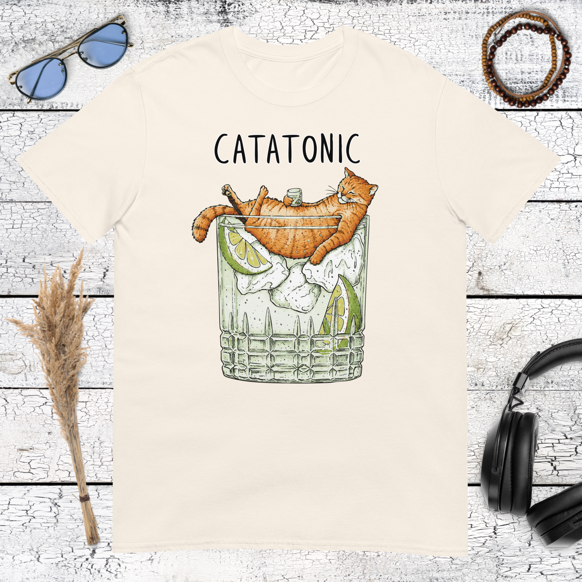 Retro orange cat holding a cocktail graphic printed on a natural cotton t-shirt