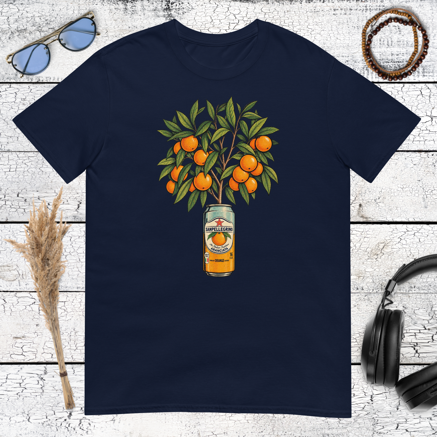 Decorative orange tree and citrus artwork printed on a navy blue t-shirt