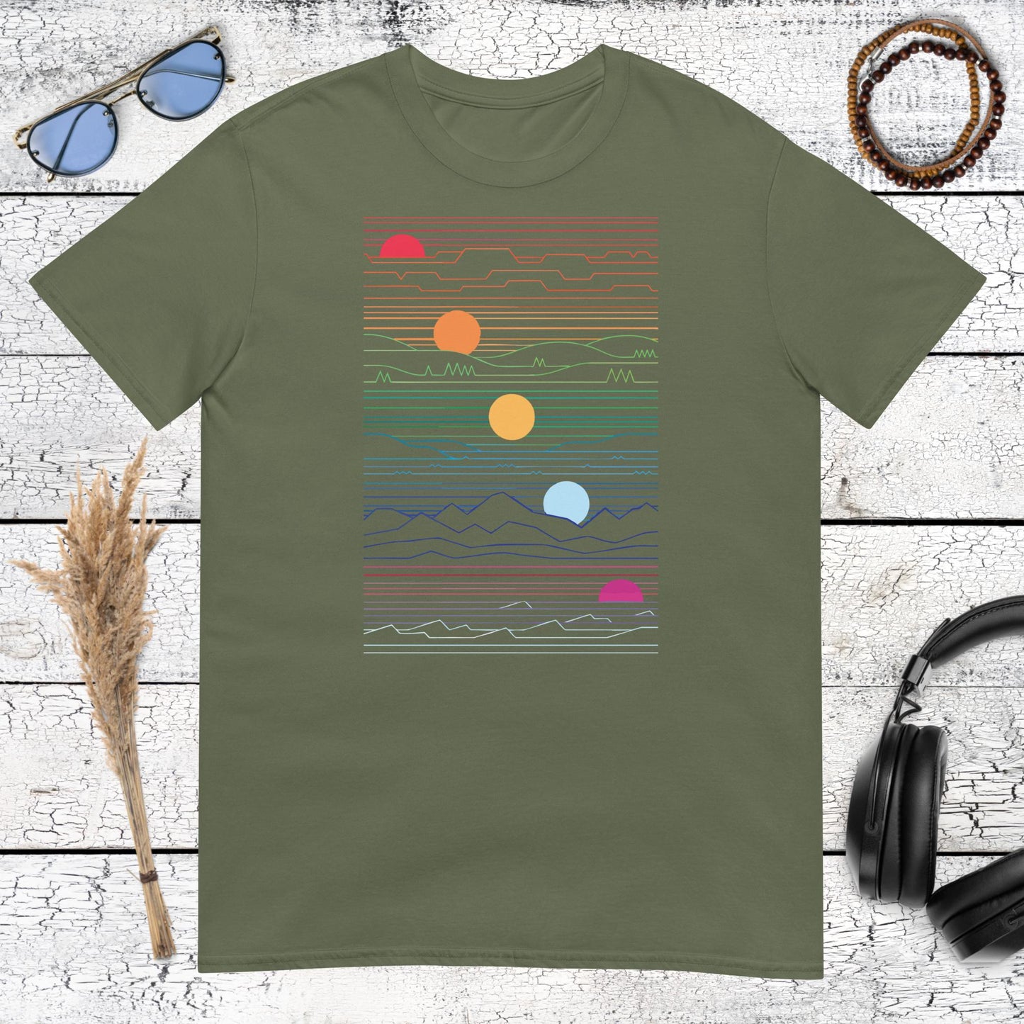 Minimalist sunset and wave line art on a military green t-shirt