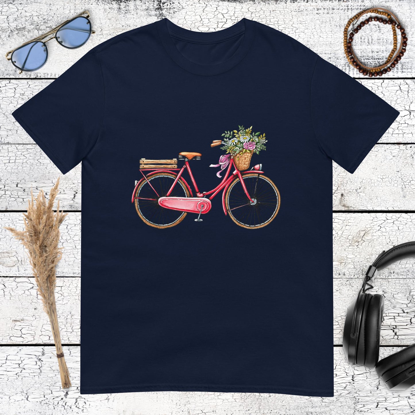 Aesthetic pink bicycle with flowers in a basket on a navy blue t-shirt