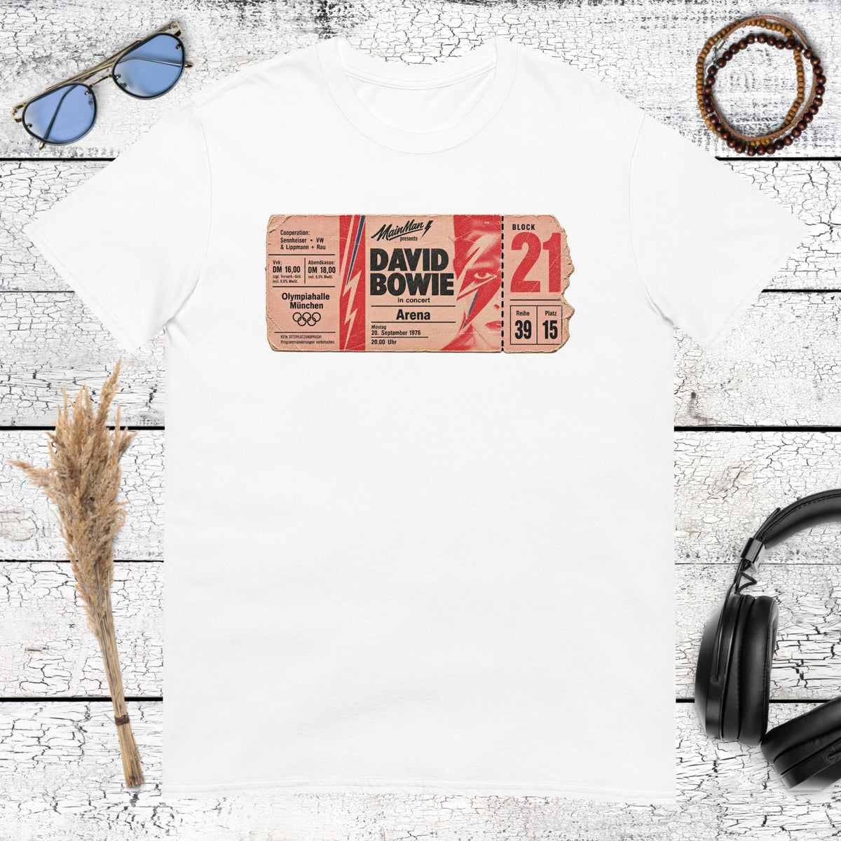 Retro music poster artwork with colourful typography printed on a white t-shirt