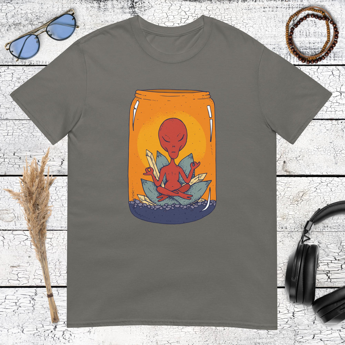 Dark grey t-shirt featuring a meditating alien in an orange sunset jar